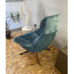 Blue velvet wivel armchair